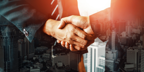 Image of a handshake and a ship with containers